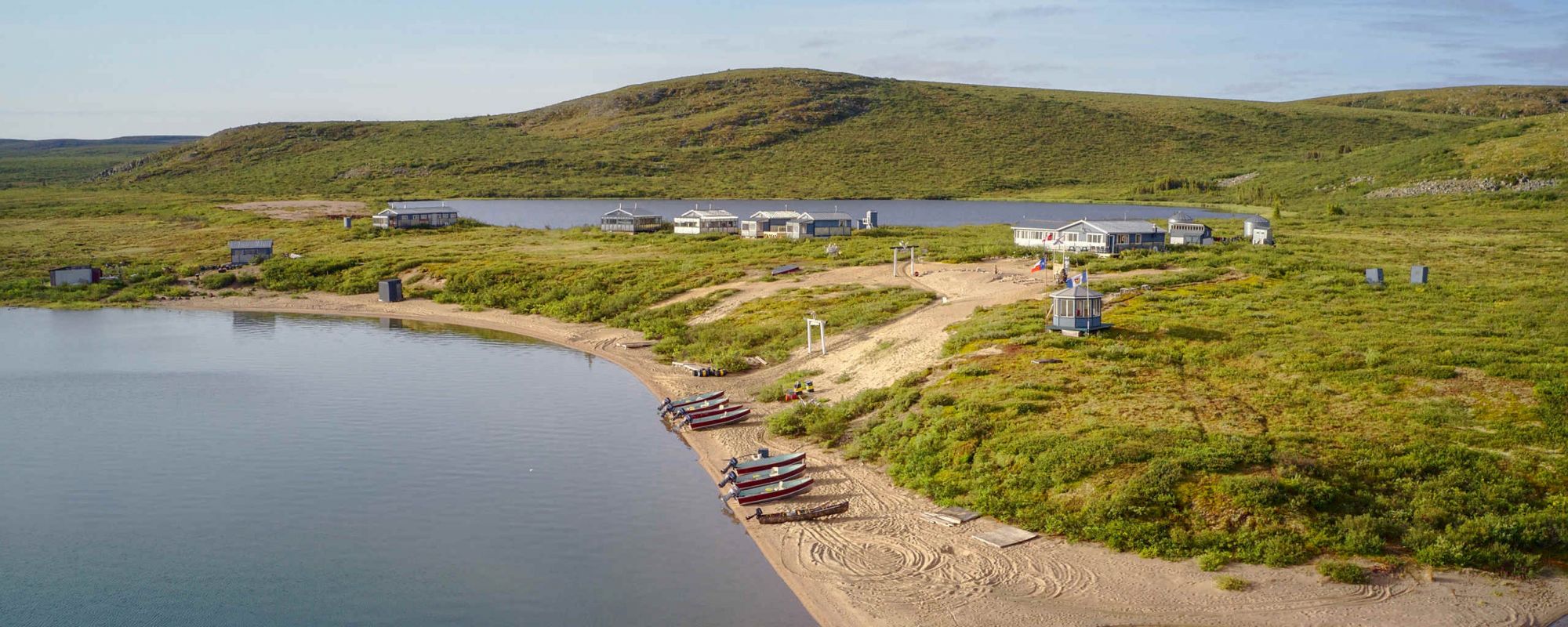 Lodge and boats on beautiful sand beach in the barrens